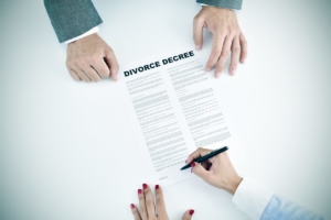 A flat fee divorce decree being signed in Jacksonville.