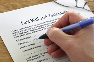 Signing of a will and testament form.