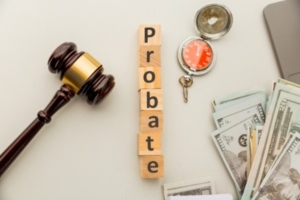 A gavel, money, key and probate sign.